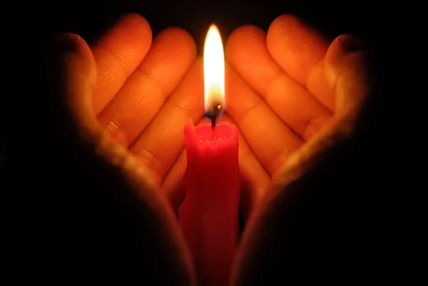 depositphotos_22724789-stock-photo-hands-holding-a-burning-candle.jpg